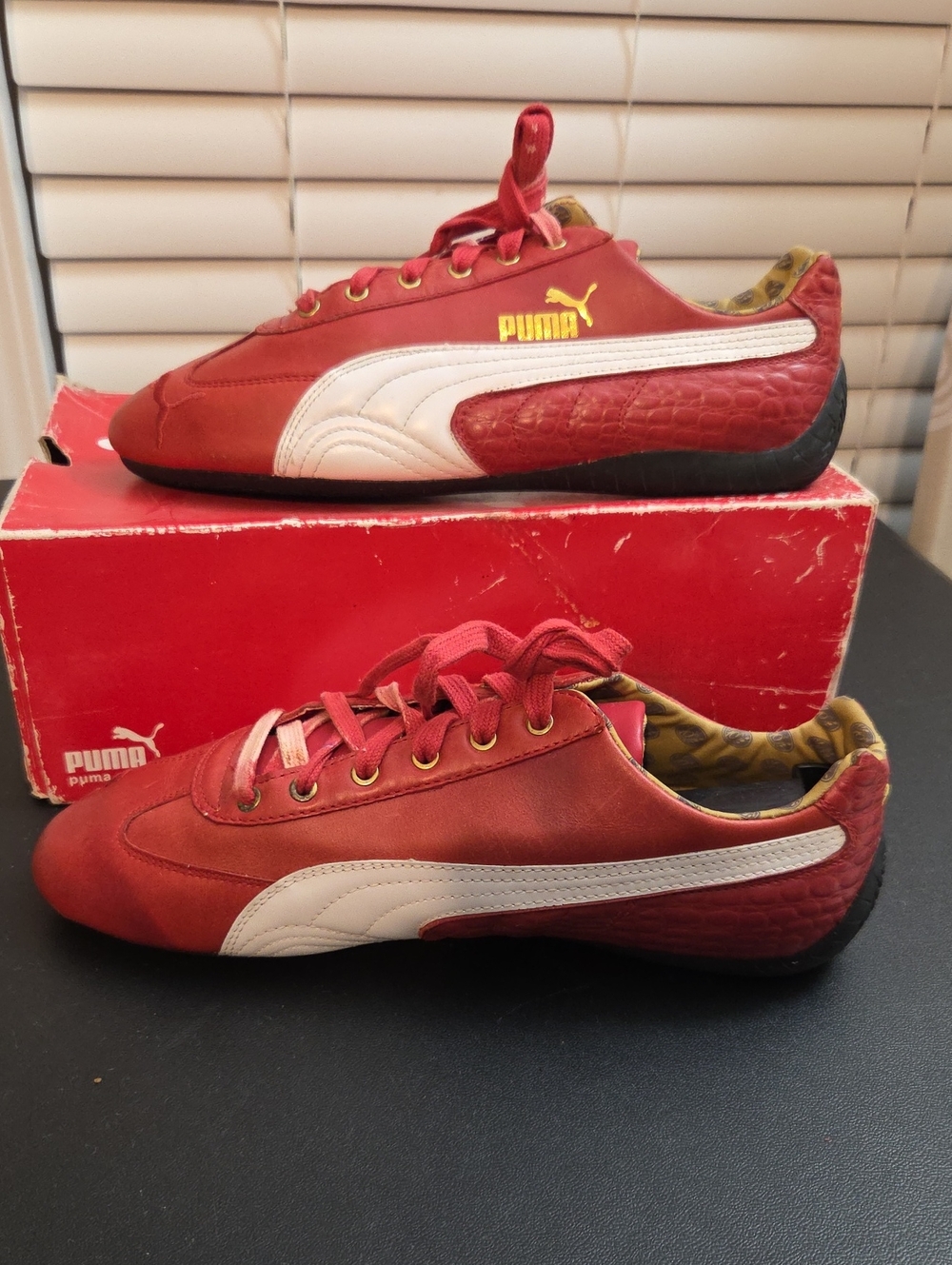 Puma Red and White Low-Profile Sneakers with Gold Logo